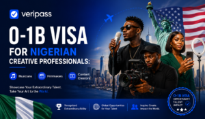 Nigerian creative professional reviewing O-1B visa documents alongside Nollywood and Afrobeats industry materials